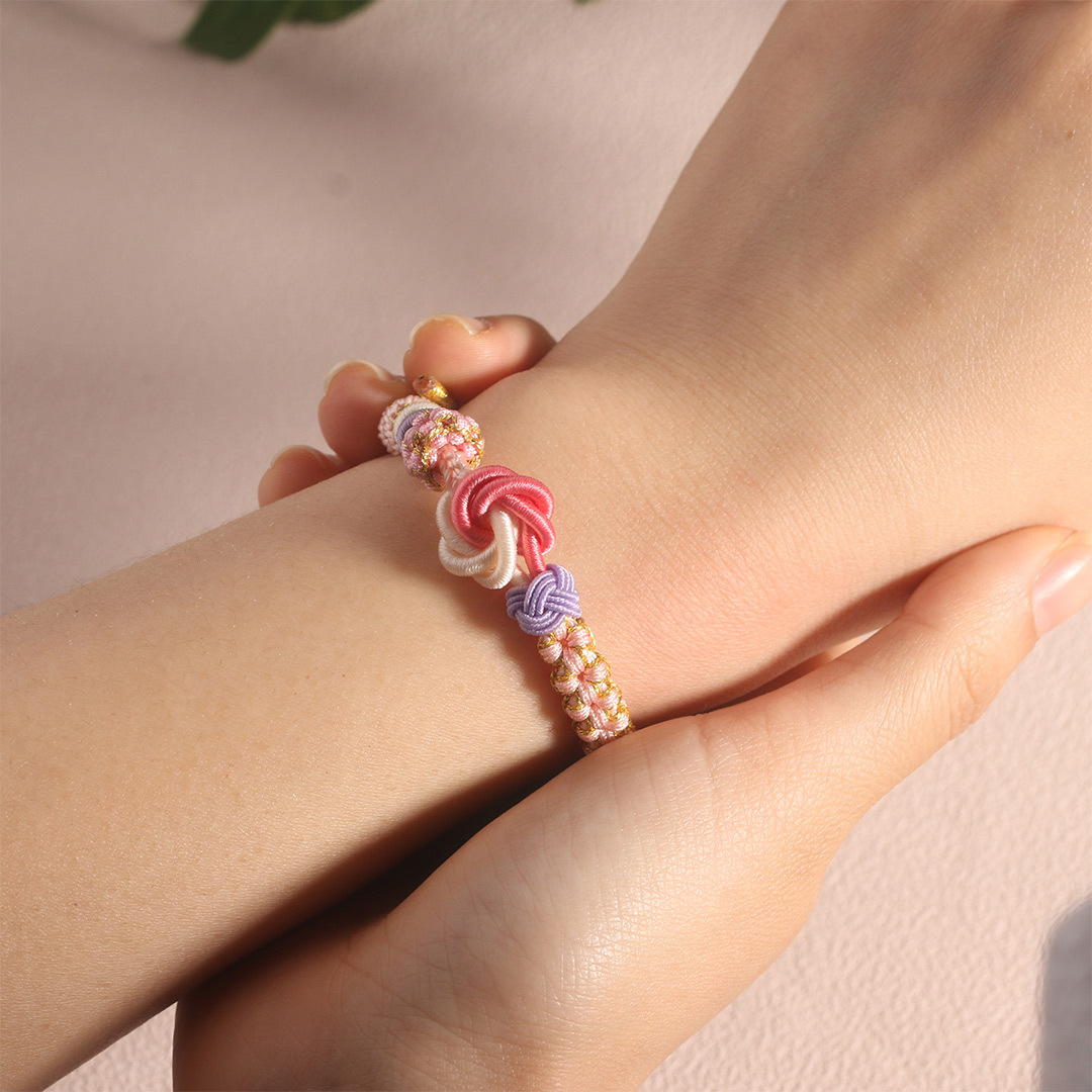 Mi Nieta - Pulsera Nudo de Flores en Rosa y Blanco