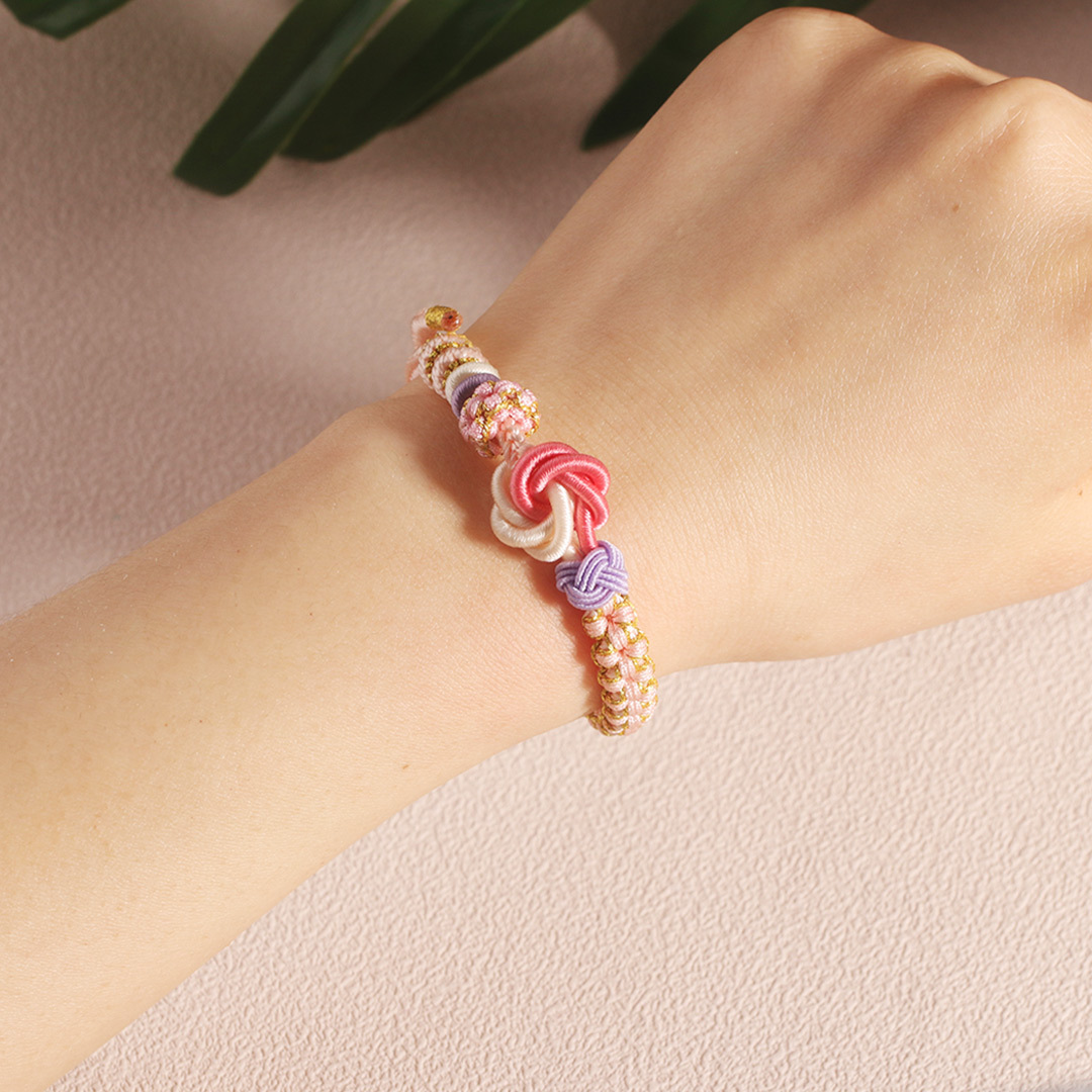 Mi Nieta - Pulsera Nudo de Flores en Rosa y Blanco