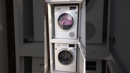 Integrated washing machine cabinet and dryer cabinet