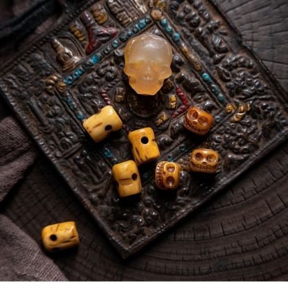 Shitro Lord Bone Bracelet: Tibetan Handcarved Goat Horn Mala with Yak Bone Skull Accents