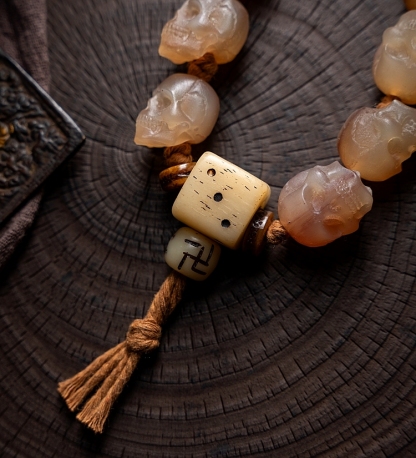 Shitro Lord Bone Bracelet: Tibetan Handcarved Goat Horn Mala with Yak Bone Skull Accents