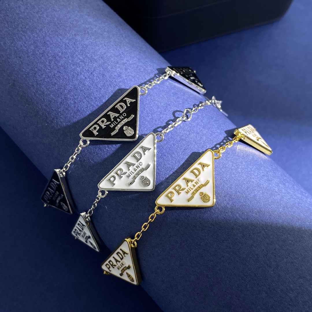 プラダ「Prada」プラダ トライアングルロゴ ドリップペイント ブレスレット ユニセ-ISETAN PRESTIGE CURATED