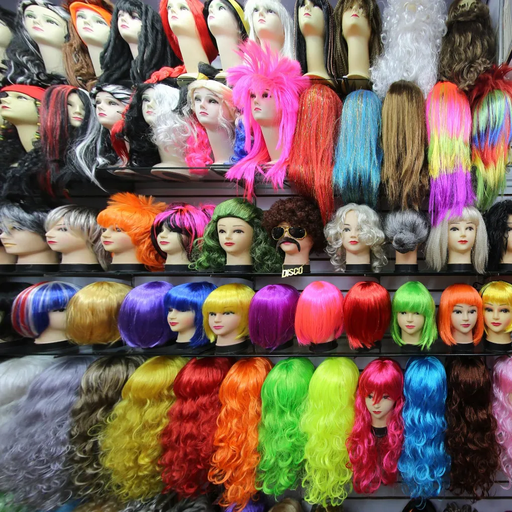 Assorted colorful party wigs display, cosplay novelty synthetic wigs for halloween carnival fancy dress bulk