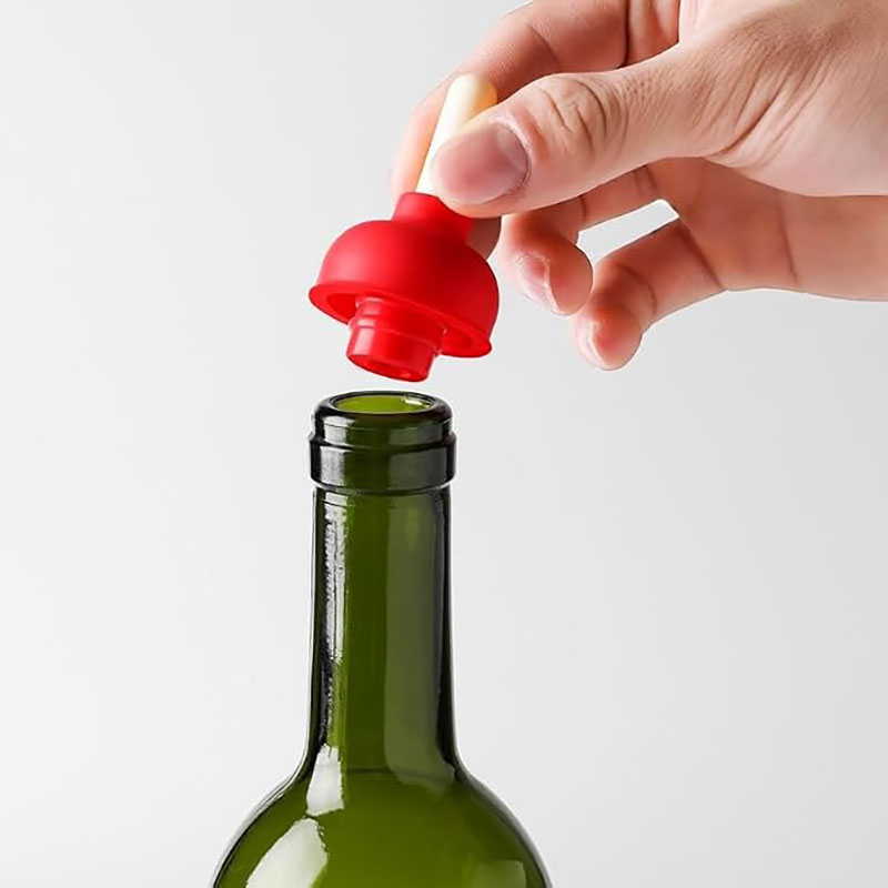 funny simulation toilet plunger food grade threaded silicone wine bottle stopper pure white background product shot