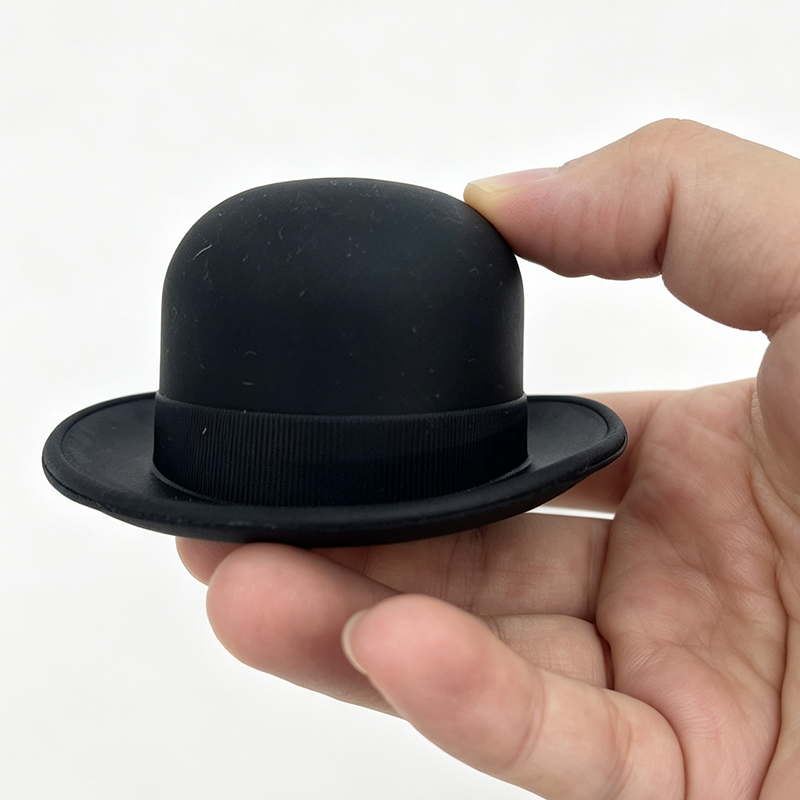 matte black ribbon band bowler derby hat food grade silicone wine bottle stopper white background product shot