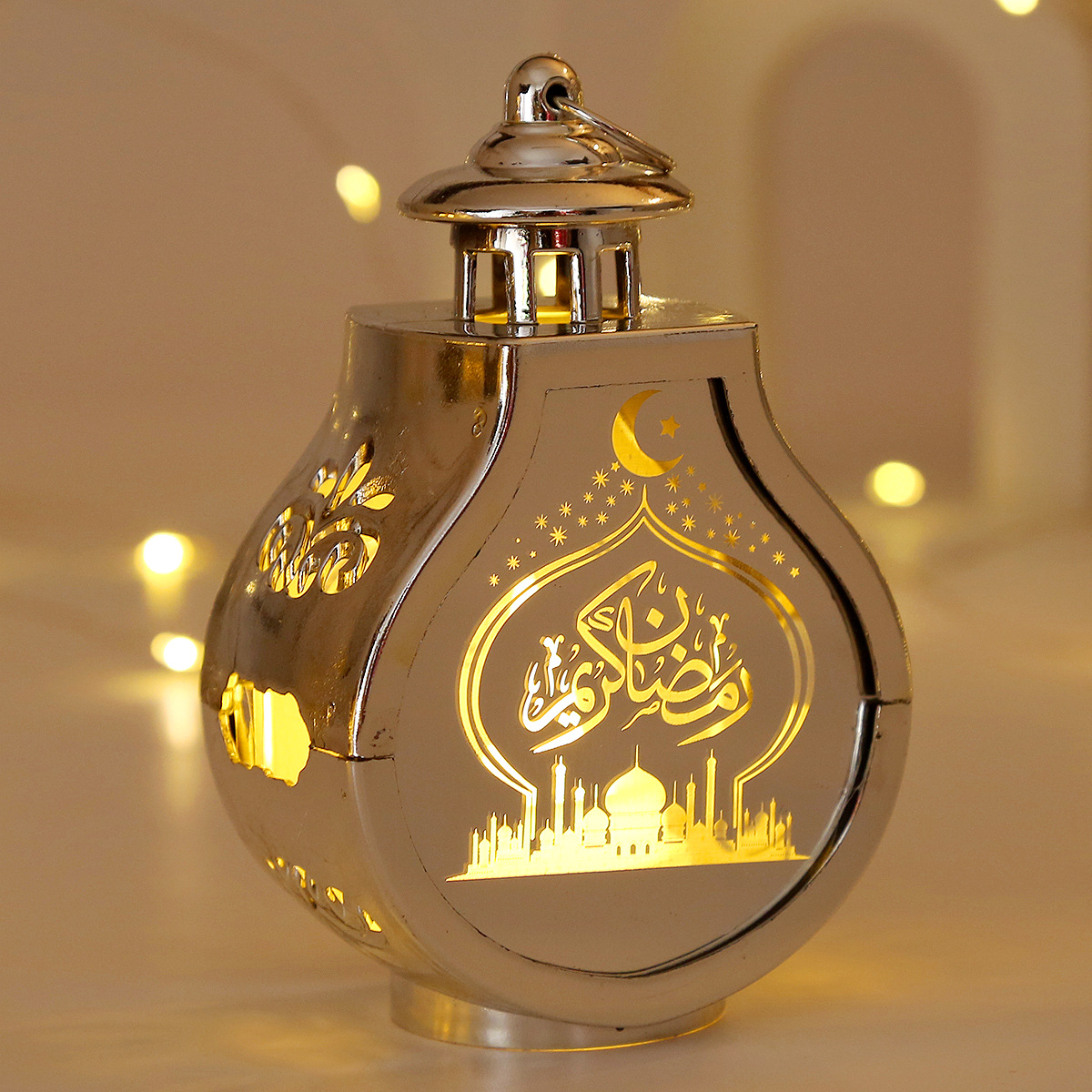 close-up laser carved crescent mosque arabic pattern translucent panel warm light effect