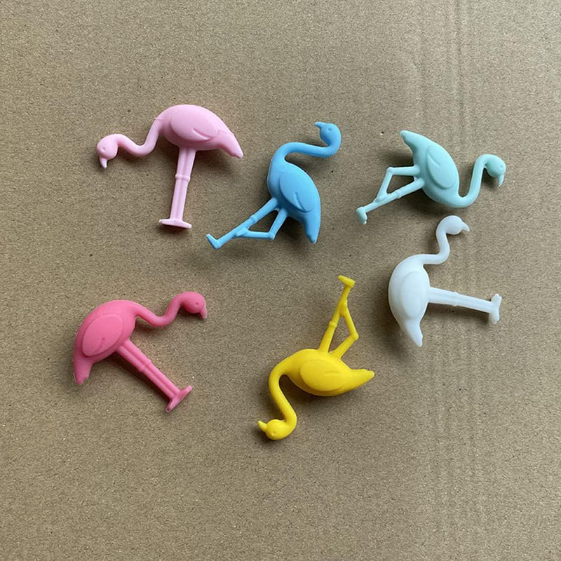 multi-color assorted pose flamingo silicone wine glass markers flat lay kraft background product shot