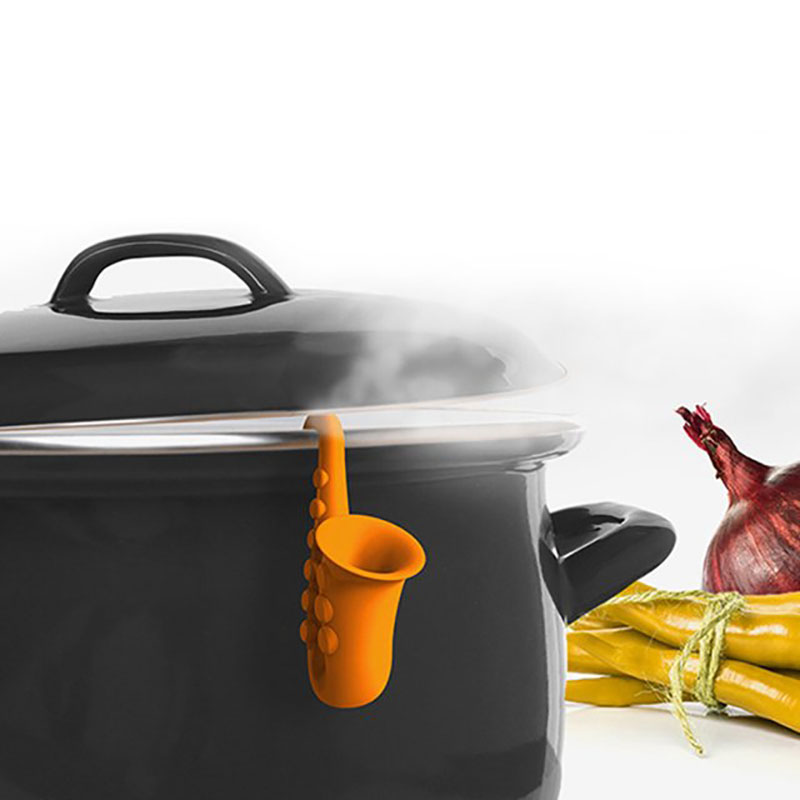 saxophone steam releaser mounted on simmer pot releasing steam display
