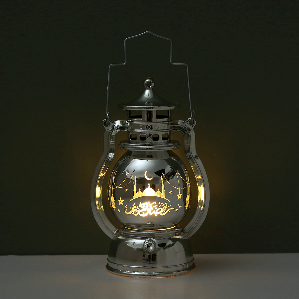 Four retro oil lamp lanterns placed on white desktop with book background