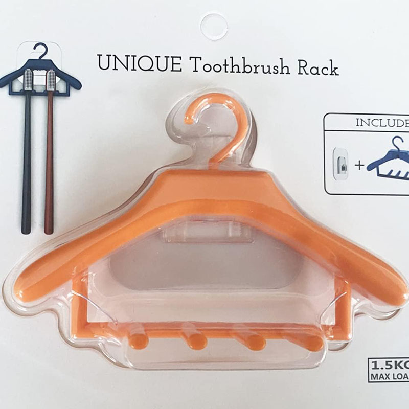 orange clothes hanger toothbrush rack retail blister card white background product photo