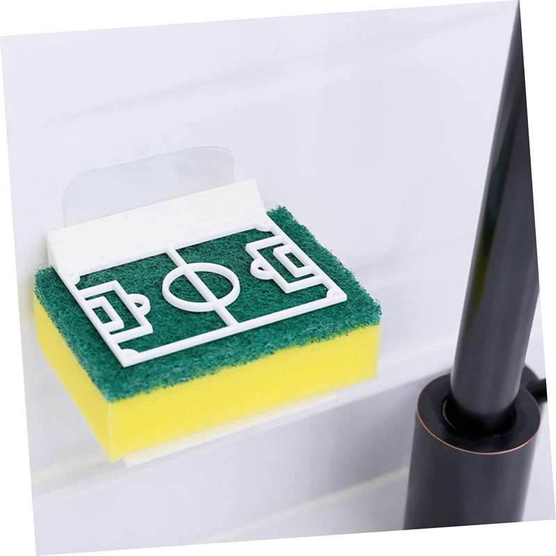football sponge holder mounted beside stainless steel kitchen sink