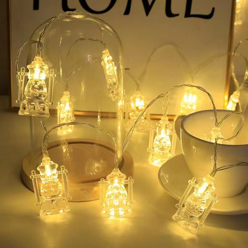 Close-up of hollow moon star mosque lantern pendants on light string