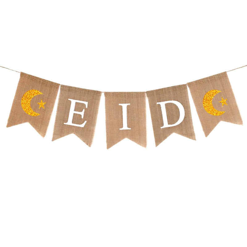 close-up gold glitter crescent moon star and white letter burlap pennant texture