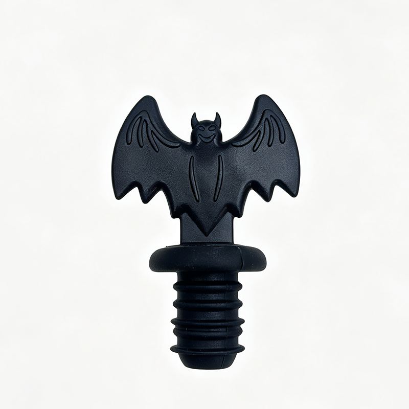 matte black embossed wing bat food grade threaded silicone wine bottle stopper pure white background product shot