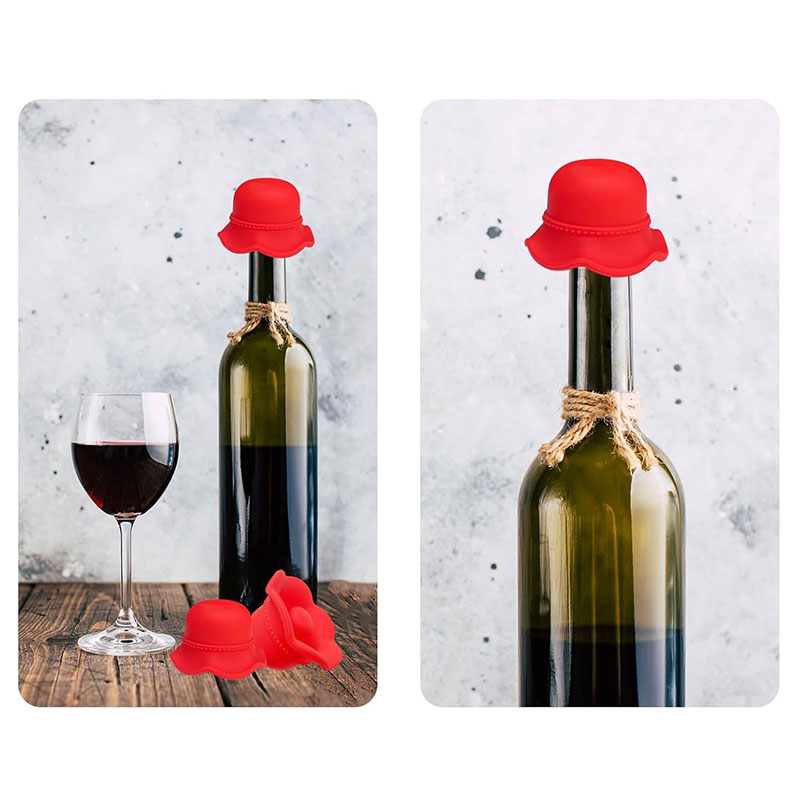 bright red scalloped brim sun hat food grade silicone wine bottle stopper inserted on green wine bottle wooden table scene