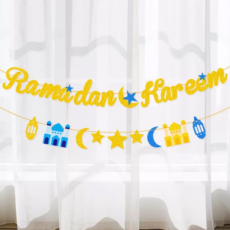 close-up shiny gold cursive Ramadan Kareem glitter letter and mosque flag cutout