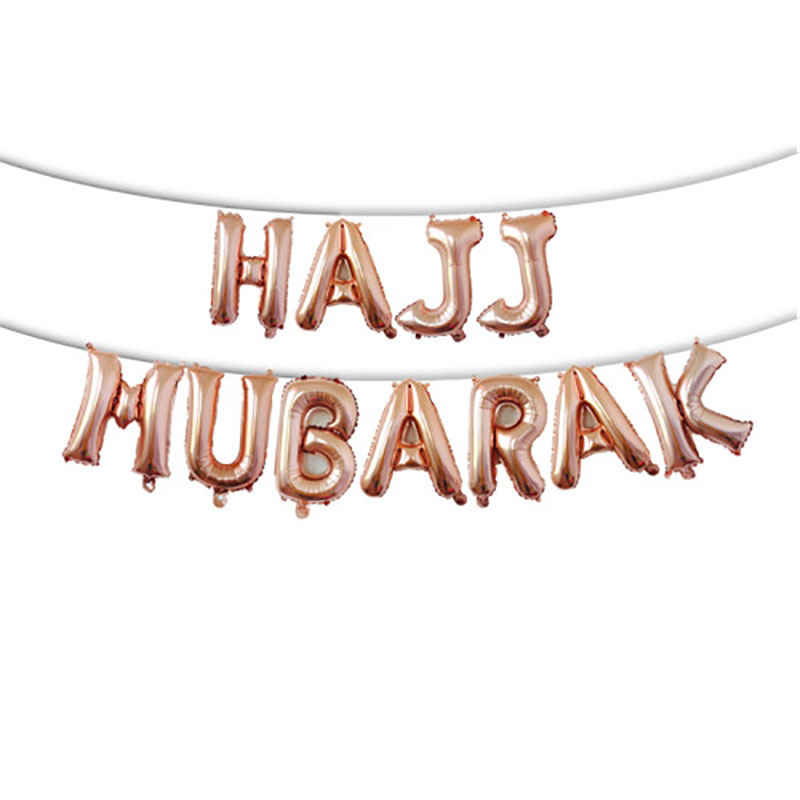 gold hajj foil balloon garlands hanging on living room white wall hajj home decor shot