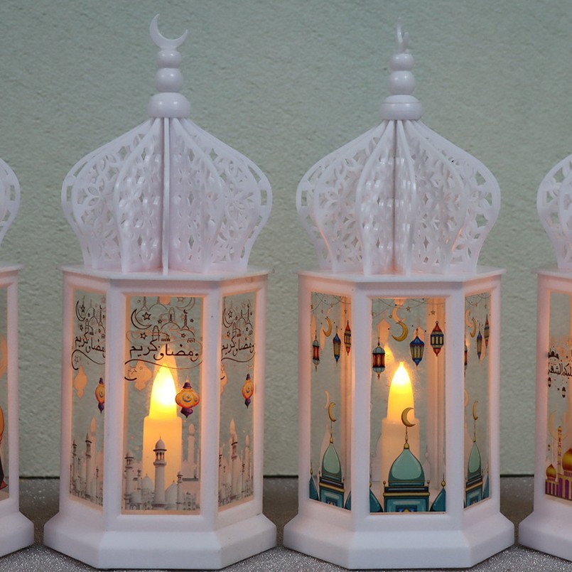 Close-up transparent panel arabic ramadan text and flickering candle luminous effect