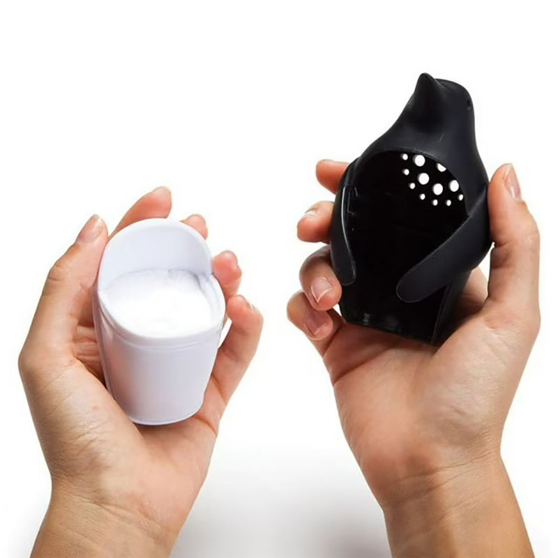close-up ventilation holes penguin fridge odor absorber texture detail