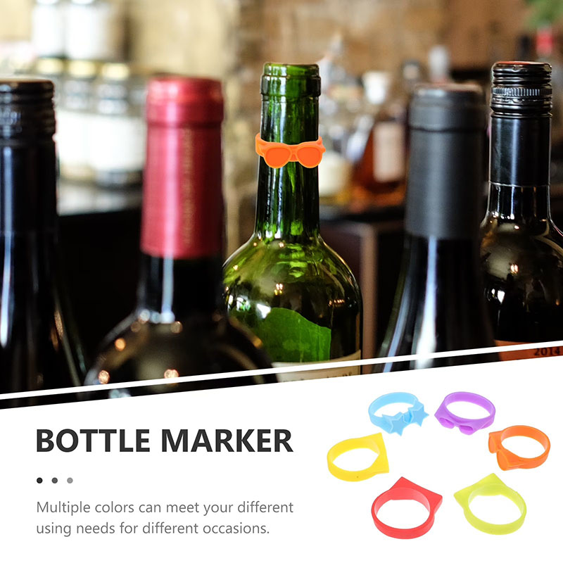 multi-color assorted shape silicone wine bottle markers on red wine bottles party scene white background