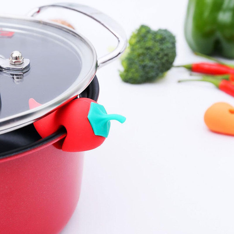 hot pepper steam releaser mounted on enamel pot while simmering food display