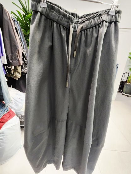 0901T GREY TROUSERS WITH DRAWSTRING WAIST AND CURVED PANELS