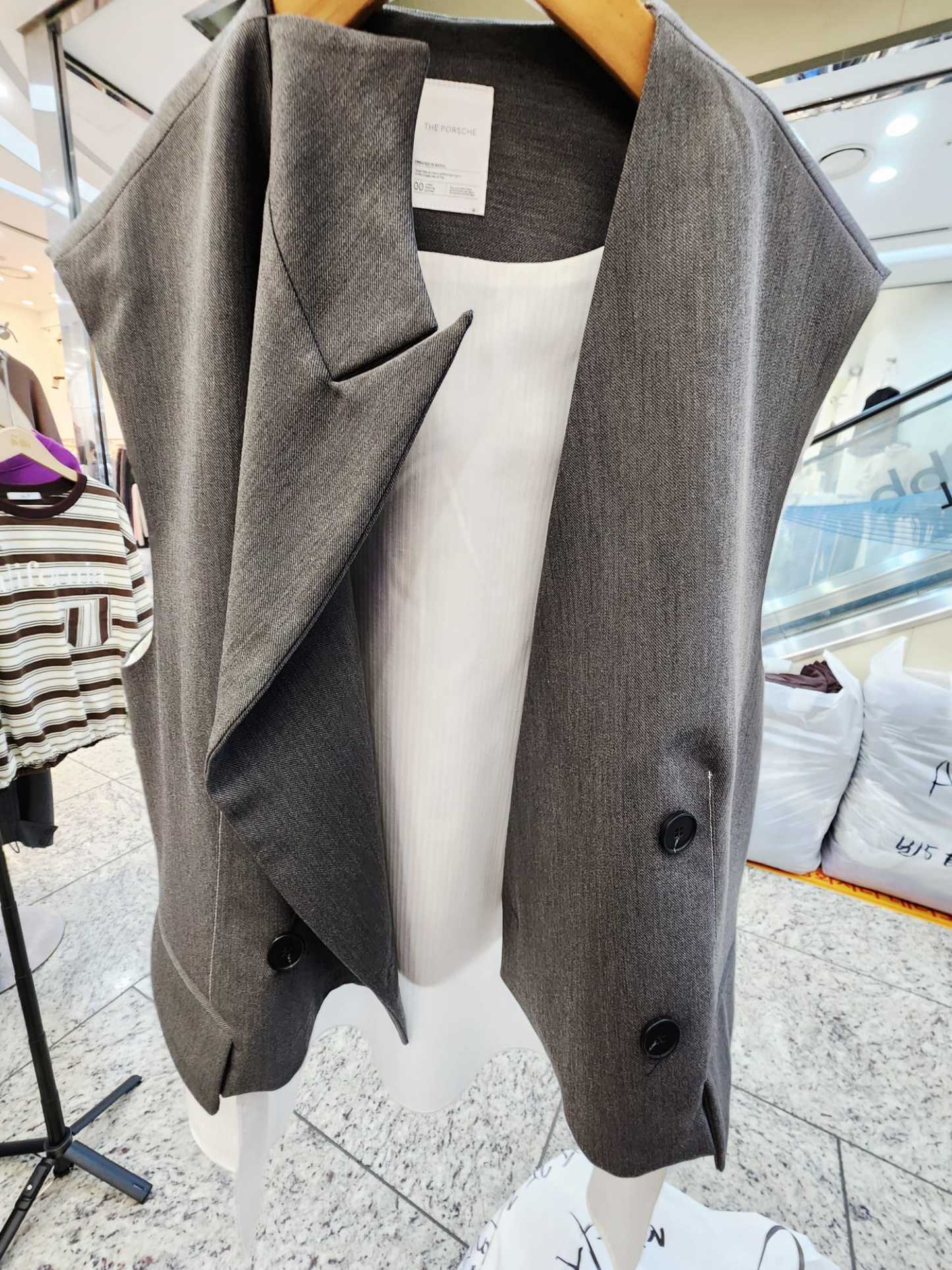 1109T GREY VEST WITH WHITE TRIM DETAILS