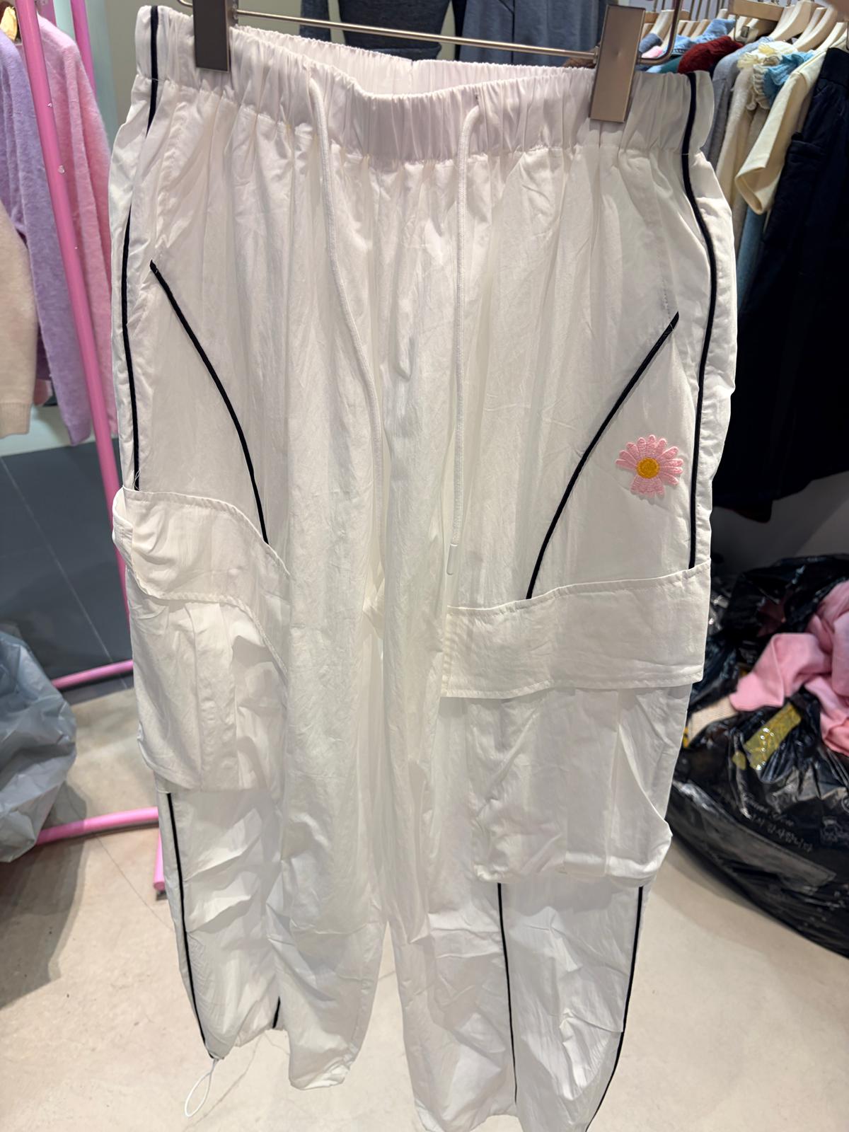 4557A WHITE WITH BLACK LINE DETAILS CASUAL, MINIMALIST TROUSERS, RELAXED FIT, WITH EMBROIDERED FLOWER DETAIL