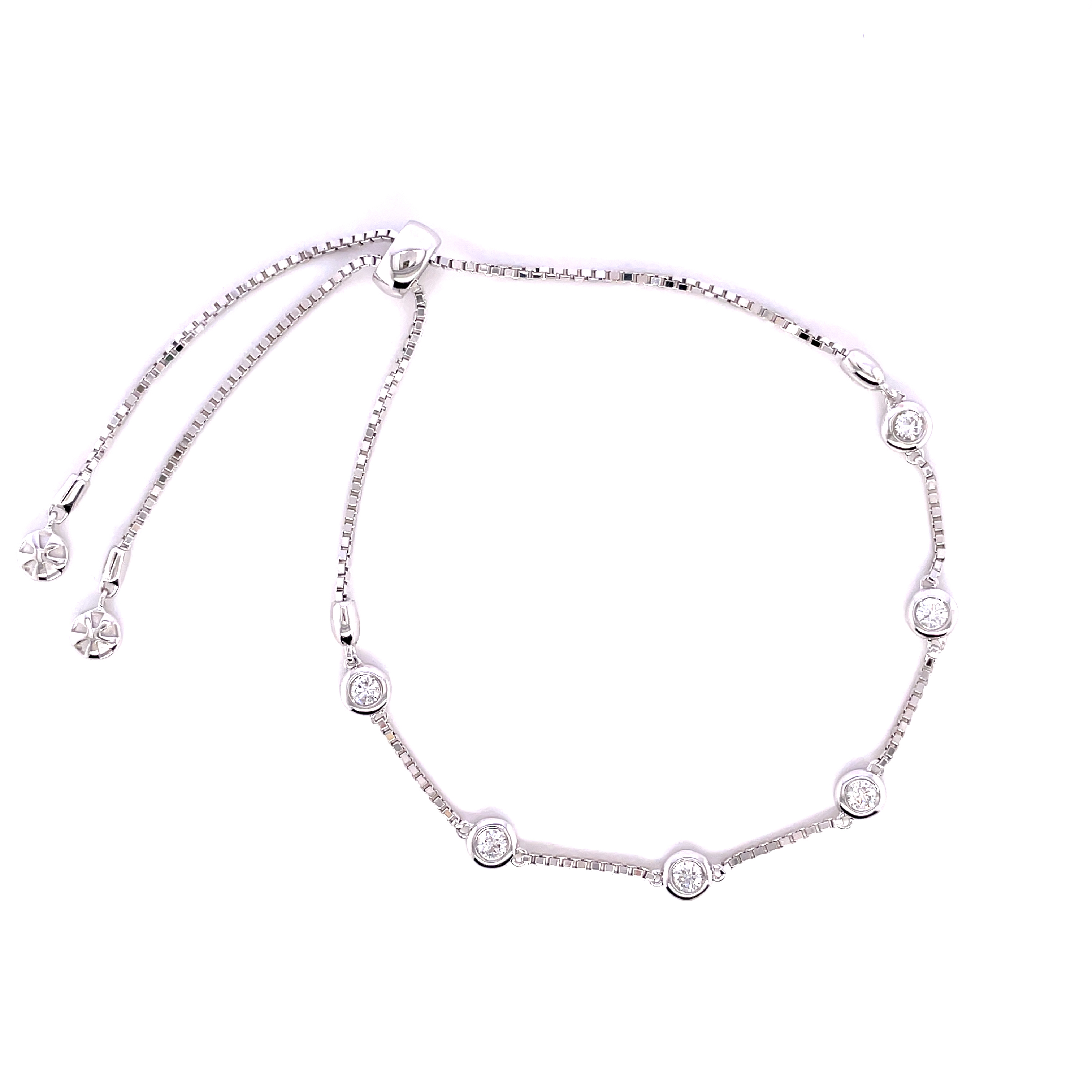 18K white gold bezel set 6-stone diamond station bracelet with adjustable bolo clasp.