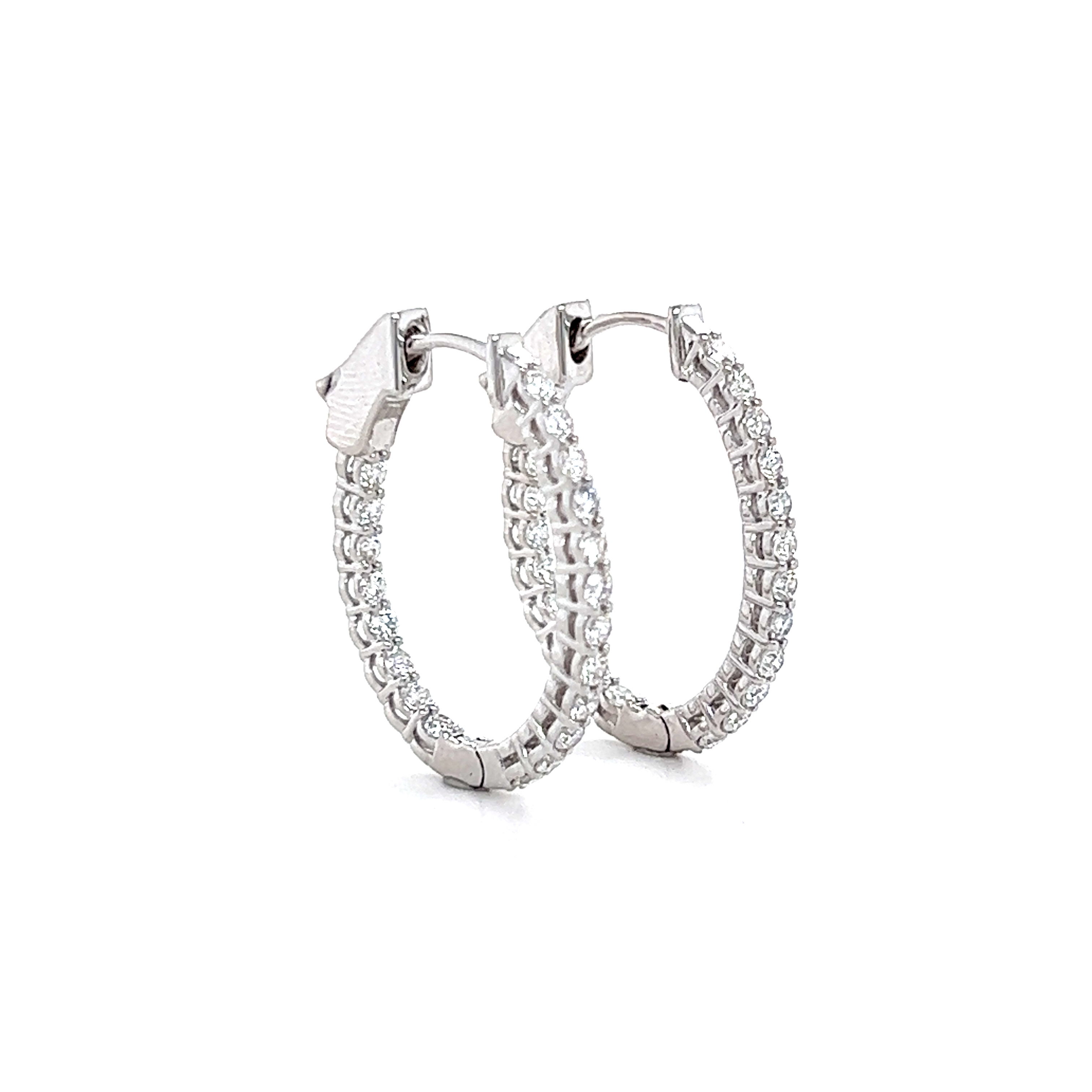 Oval shaped inside-out diamond hoop earrings, 0.69ctw.