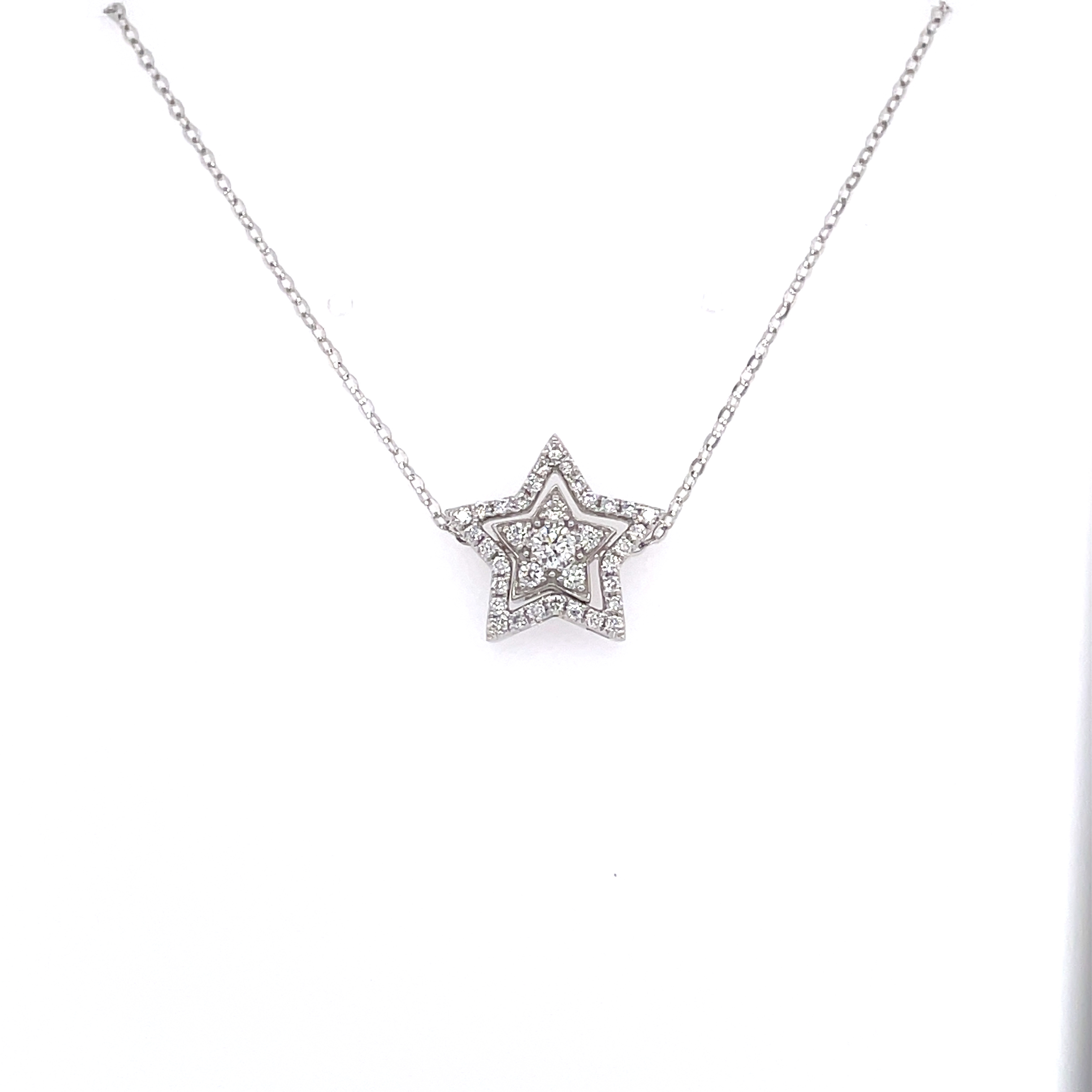 18k white gold diamond star necklace showing inner and outer stars combined.