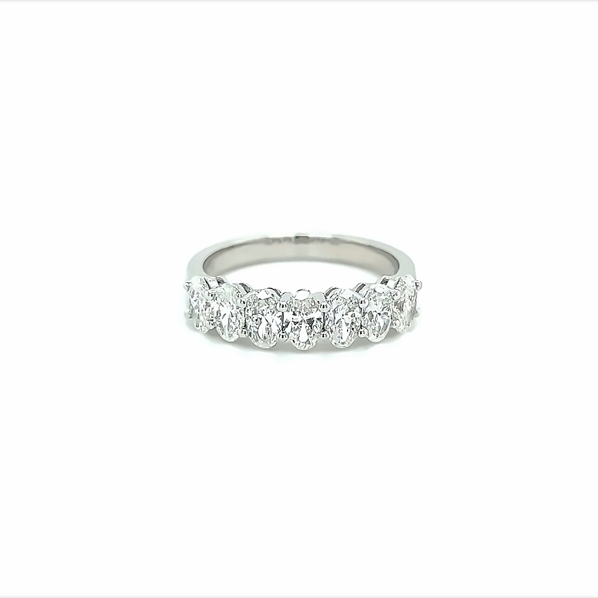 1.30ct oval cut seven stone diamond ring in 18k white gold.