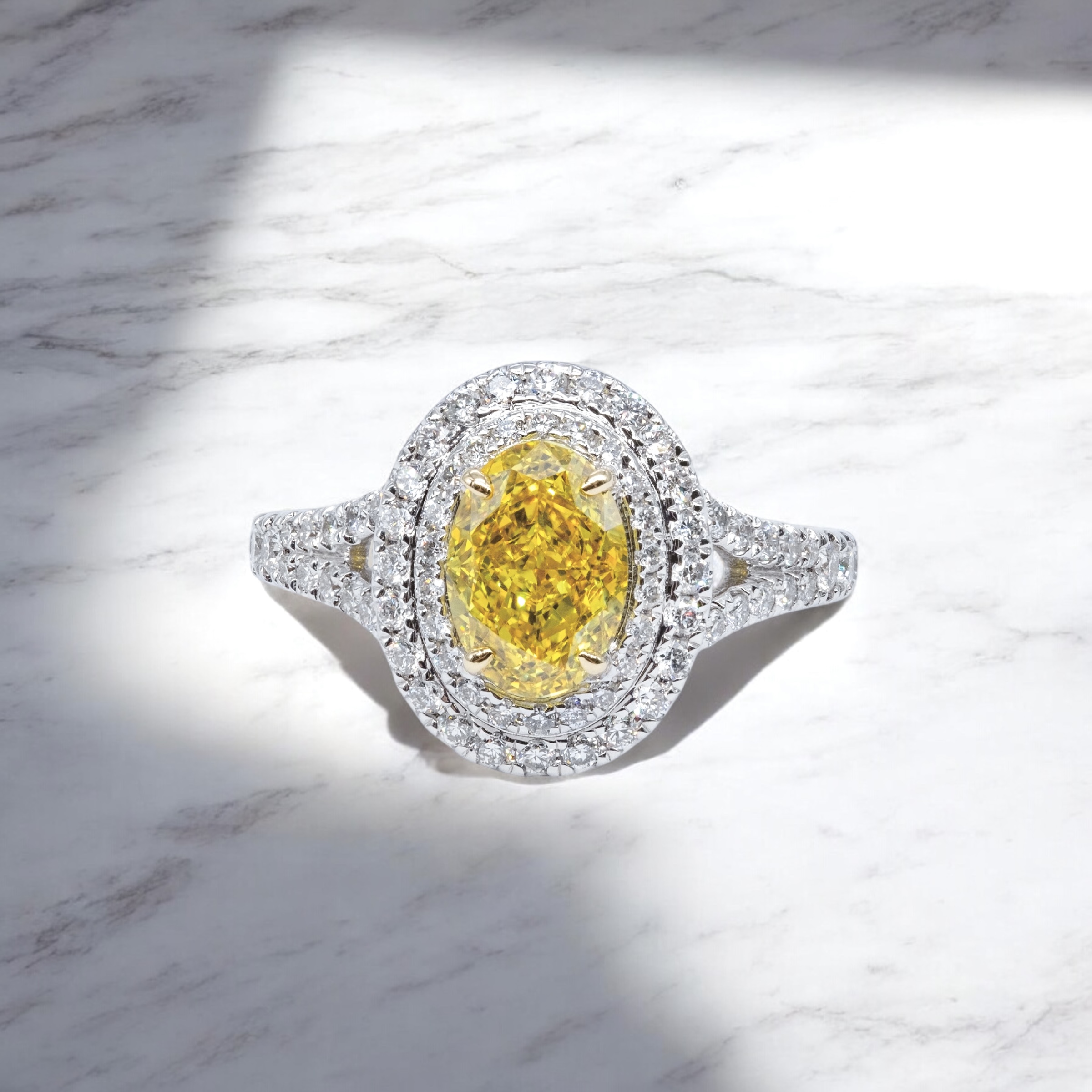 double halo oval yellow diamond ring