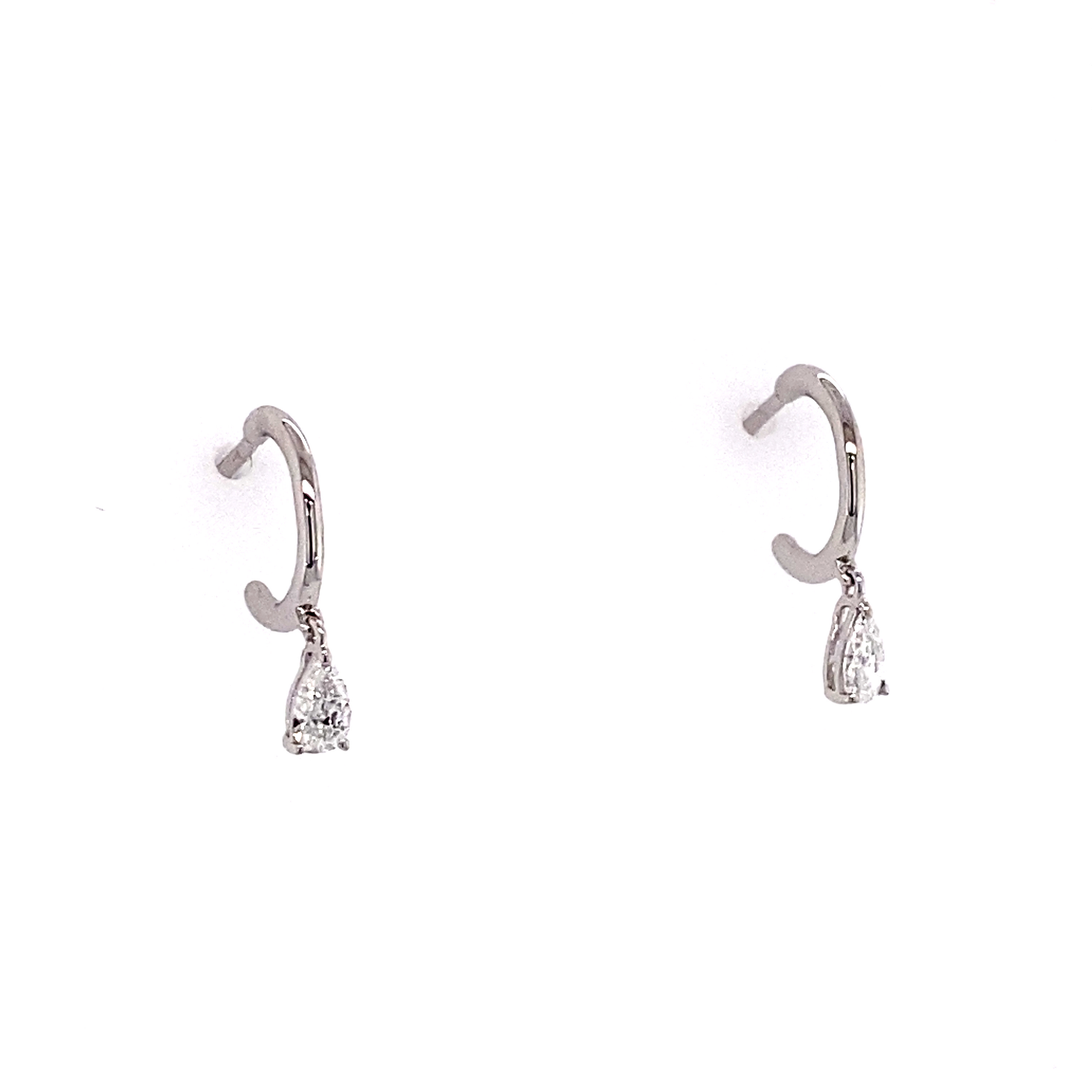 Minimalist pear drop diamond hoop earrings in white gold.

