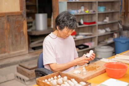 佐土原人形（高約 60 mm） 「饅頭喰い人形」日本×台灣限定雙人偶組