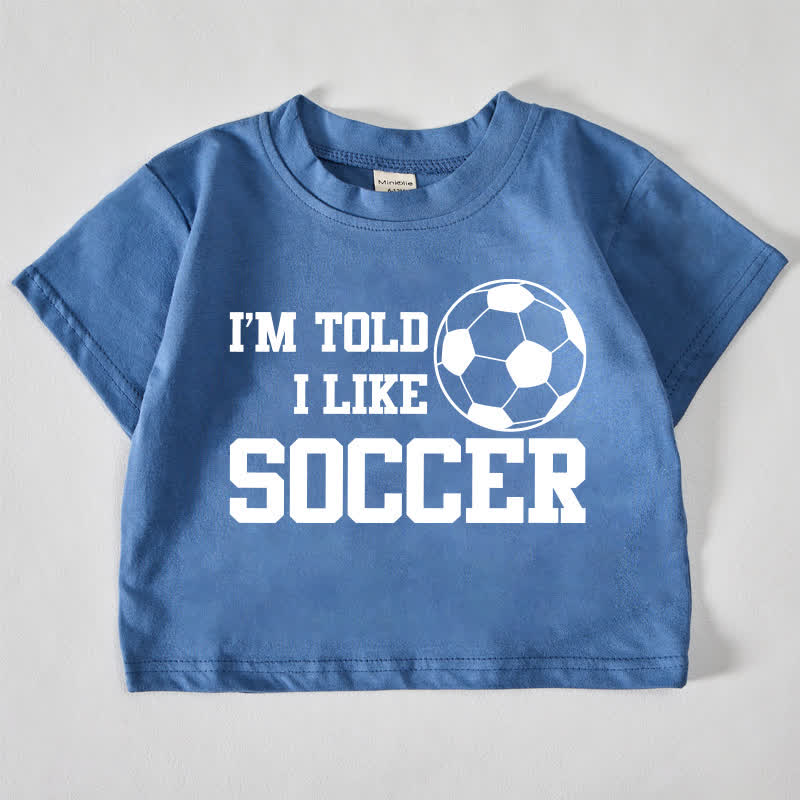 I'M TOLD I LIKE SOCCERベビー用フットボールプリント ブルーTシャツ - 青 - 18～24ヶ月 - image 1
