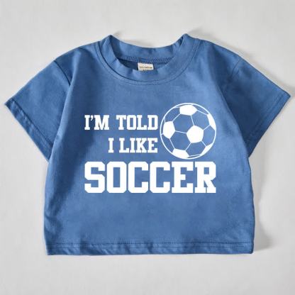 I'M TOLD I LIKE SOCCERベビー用フットボールプリント ブルーTシャツ - 青 - 18～24ヶ月 - image 1