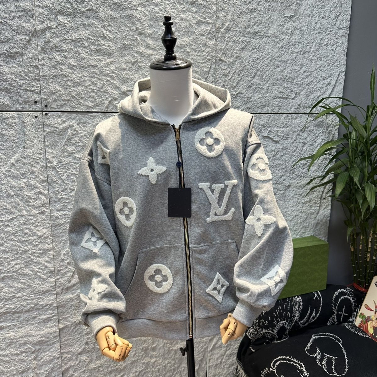 通気性と汎用性に優れた、男女兼用の新しいファッションフード付きカーディガンニットセーター