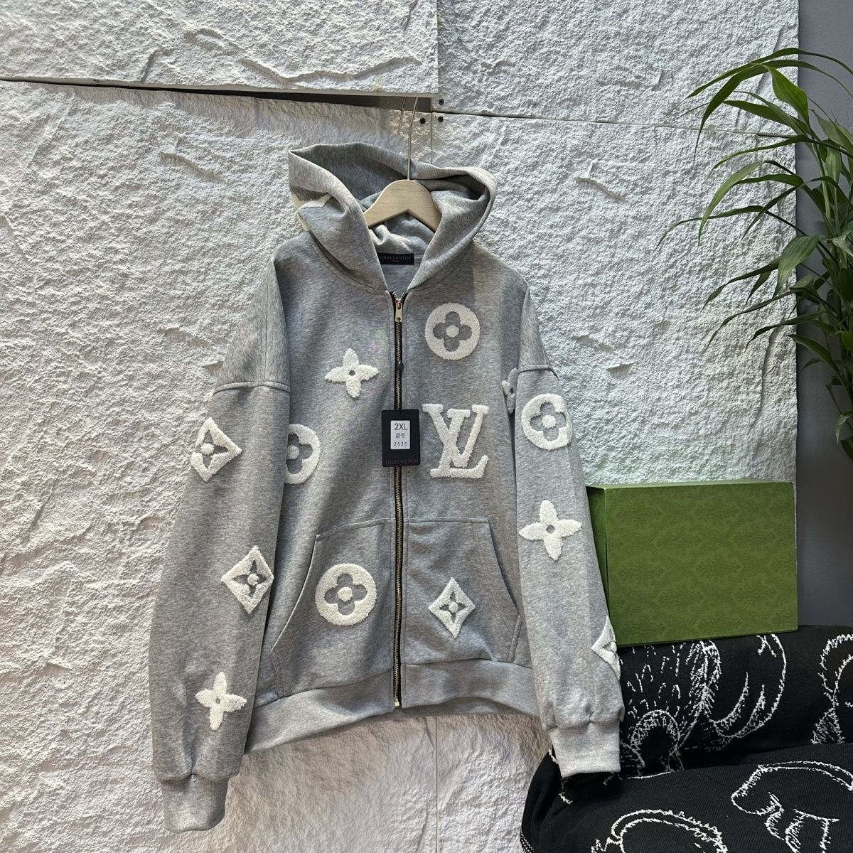 通気性と汎用性に優れた、男女兼用の新しいファッションフード付きカーディガンニットセーター