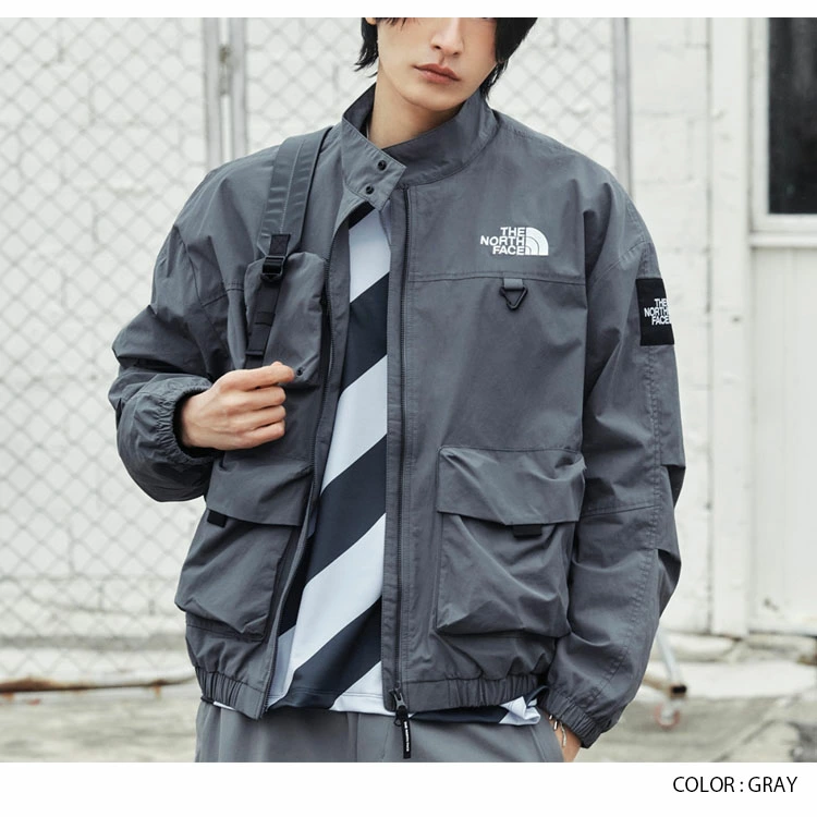 ザ・ノース・フェイスのニールトンジャケットは、ロゴ入りのハイカラーウィンドブレーカーで、カジュアルなストリートウェア風デザインが特徴です。ホワイト、ブラック、グレー、ベージュの4色展開。ユニセックス。