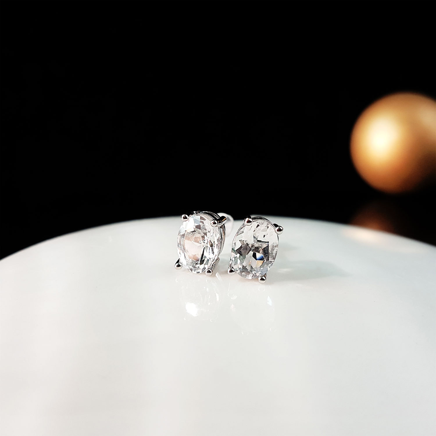 Clear Quartz Oval with Four Claws Earrings