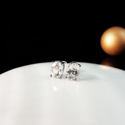 Clear Quartz Oval with Four Claws Earrings