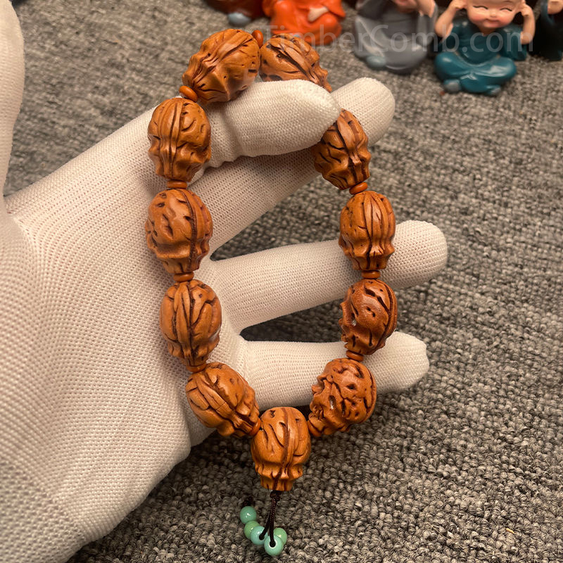 特選腕輪念珠 木玉ブレス 骸骨彫り(髑髏彫り) 桃の核 12mm玉 内周約