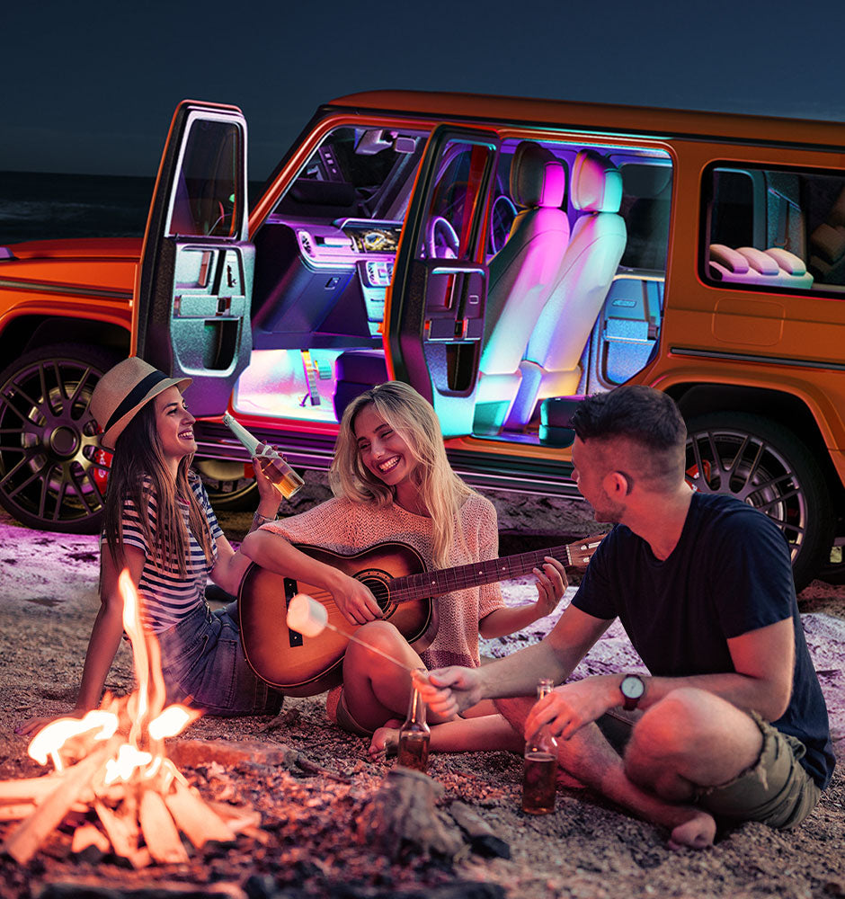 a group of people sitting around a fire