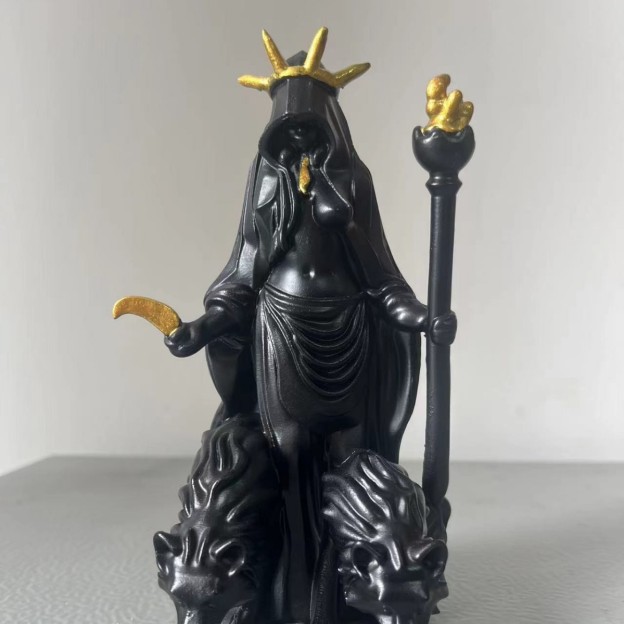 A sculpture of a dark goddess holding a torch, a resin ornament ✨ that brings a sense of healing and relaxation.