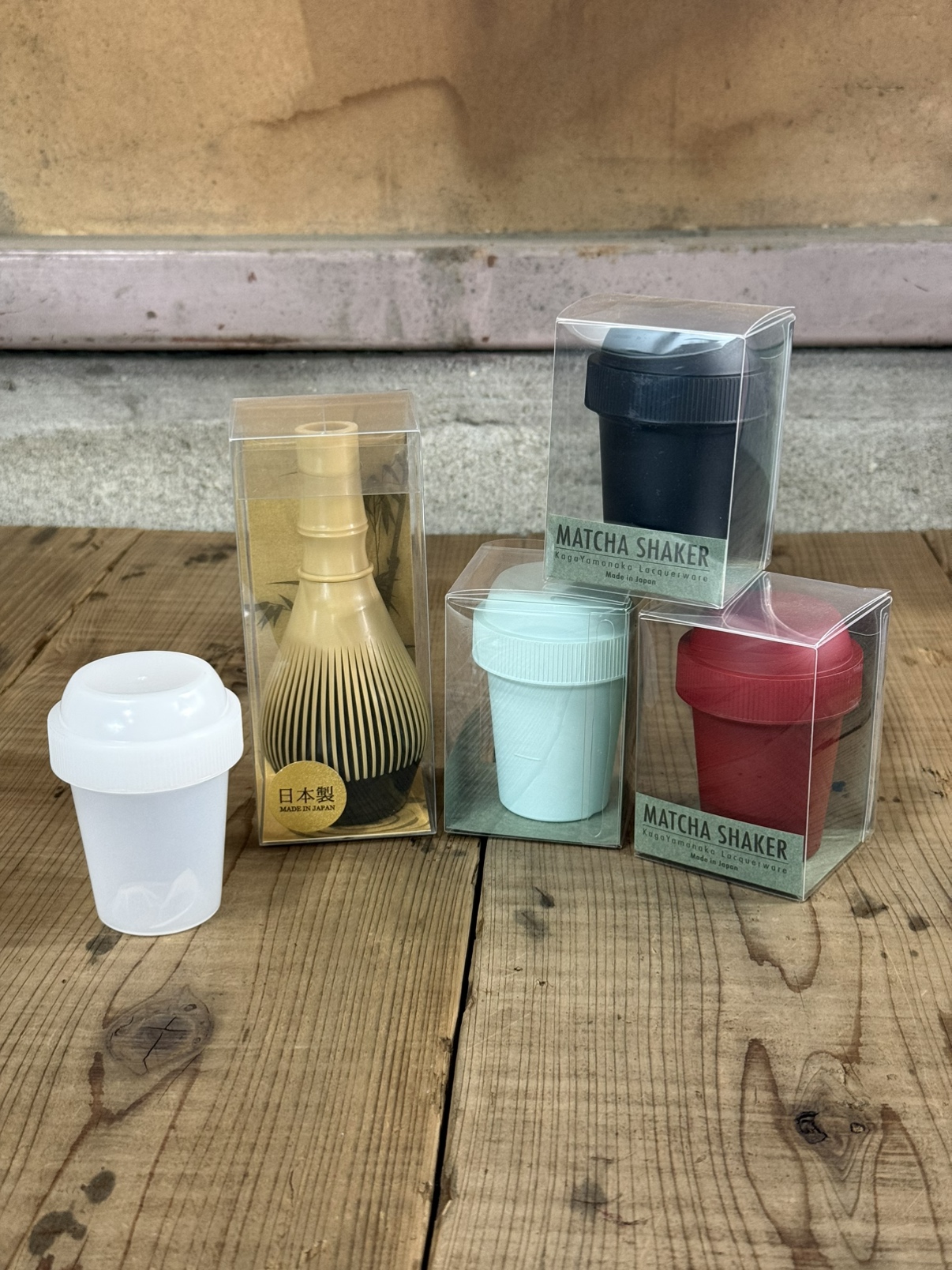 Fugetsu resin matcha chasen and colorful Japanese matcha shakers side by side.