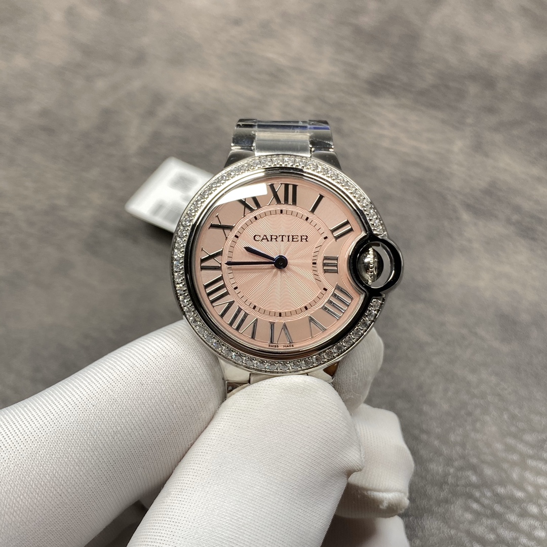Cartier Ballon Bleu Collection! Model WE9003Z3, ladies' watch with a 33mm case diameter. The pink Ballon Bleu has always been a classic, and this version features a steel bracelet with diamond accents.