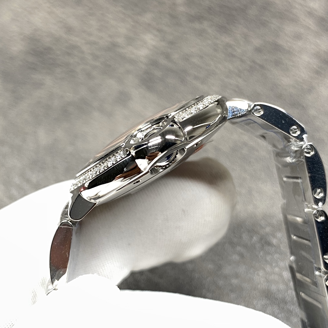 Cartier Ballon Bleu Collection! Model WE9003Z3, ladies' watch with a 33mm case diameter. The pink Ballon Bleu has always been a classic, and this version features a steel bracelet with diamond accents.