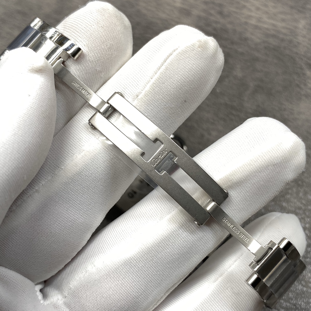 Cartier Ballon Bleu Collection! Model WE9003Z3, ladies' watch with a 33mm case diameter. The pink Ballon Bleu has always been a classic, and this version features a steel bracelet with diamond accents.