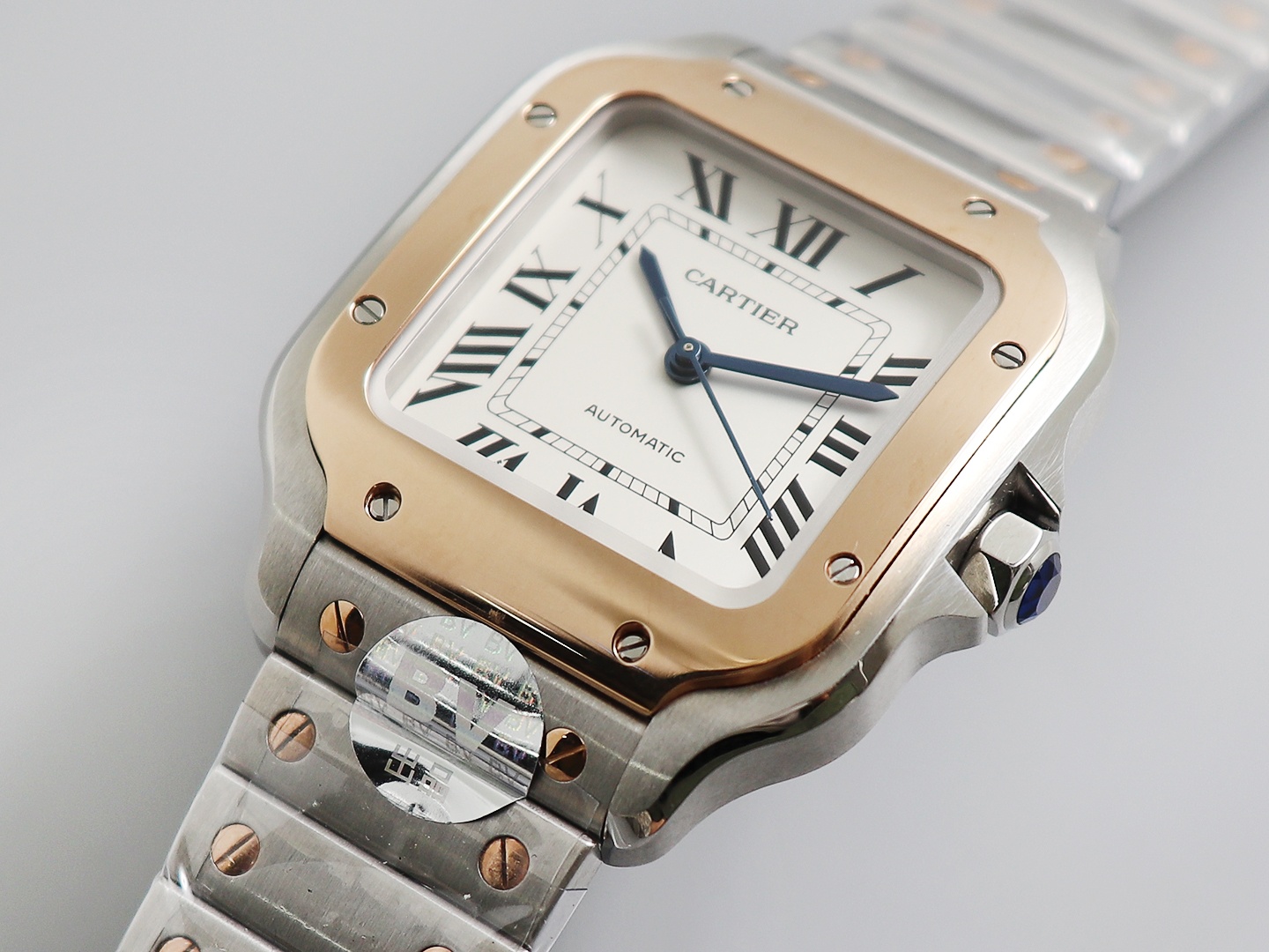 Ladies' Medium - Cartier New Santos Case: 316L stainless steel Dial: Gradient blue Hands: Swiss-crafted burnt steel blue Glass: Swiss anti-reflective coating/anti-scratch/anti-fingerprint AF treatment Strap: Features ergonomic SmartLink detachment system.